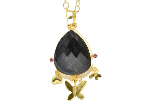 Handmade pendant showcasing a checker-cut pear-shaped Onyx