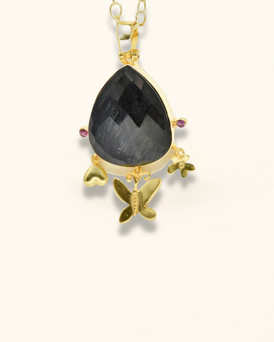 Handmade Pendant Showcasing A Checker-Cut Pear-Shaped Onyx