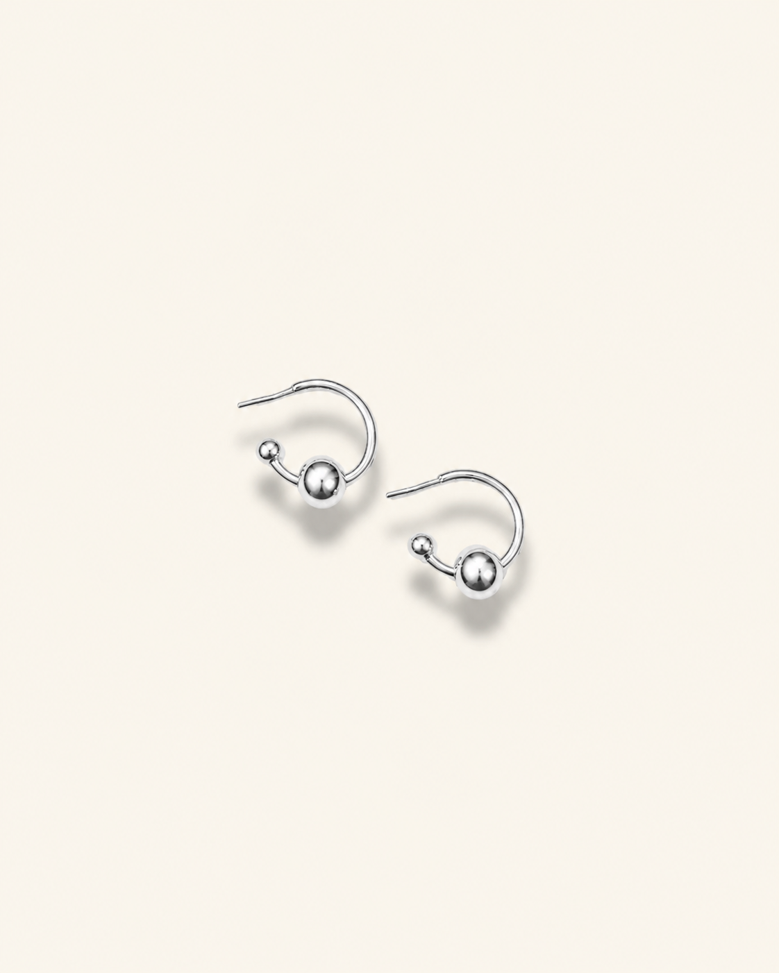 Pair of earrings with blue and yellow circular designs on a white background